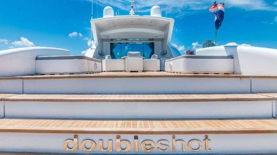 a white boat with a person from it aboard DOUBLE SHOT Yacht for Charter