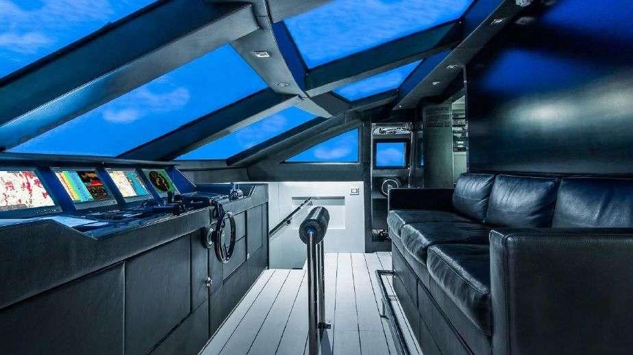 a boat with a large screen aboard DOUBLE SHOT Yacht for Charter