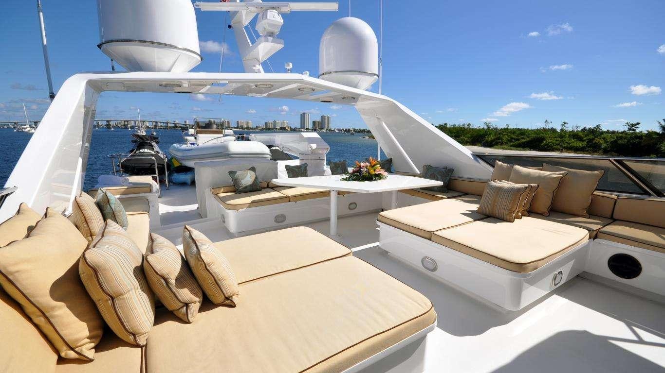 a room with a table and chairs aboard LUCKY STARS Yacht for Charter