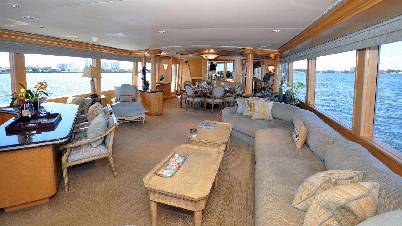 a living room with a large window aboard LUCKY STARS Yacht for Charter