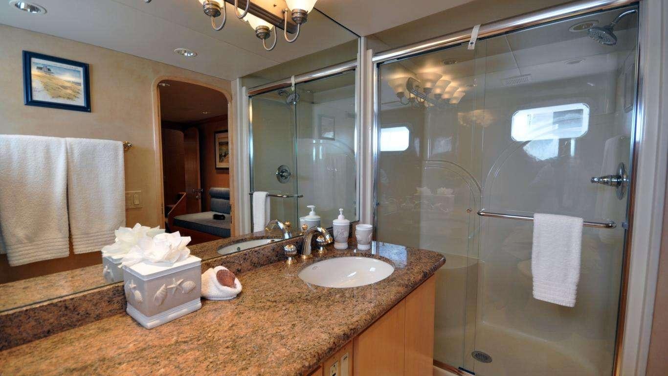 a bathroom with a large mirror aboard LUCKY STARS Yacht for Charter