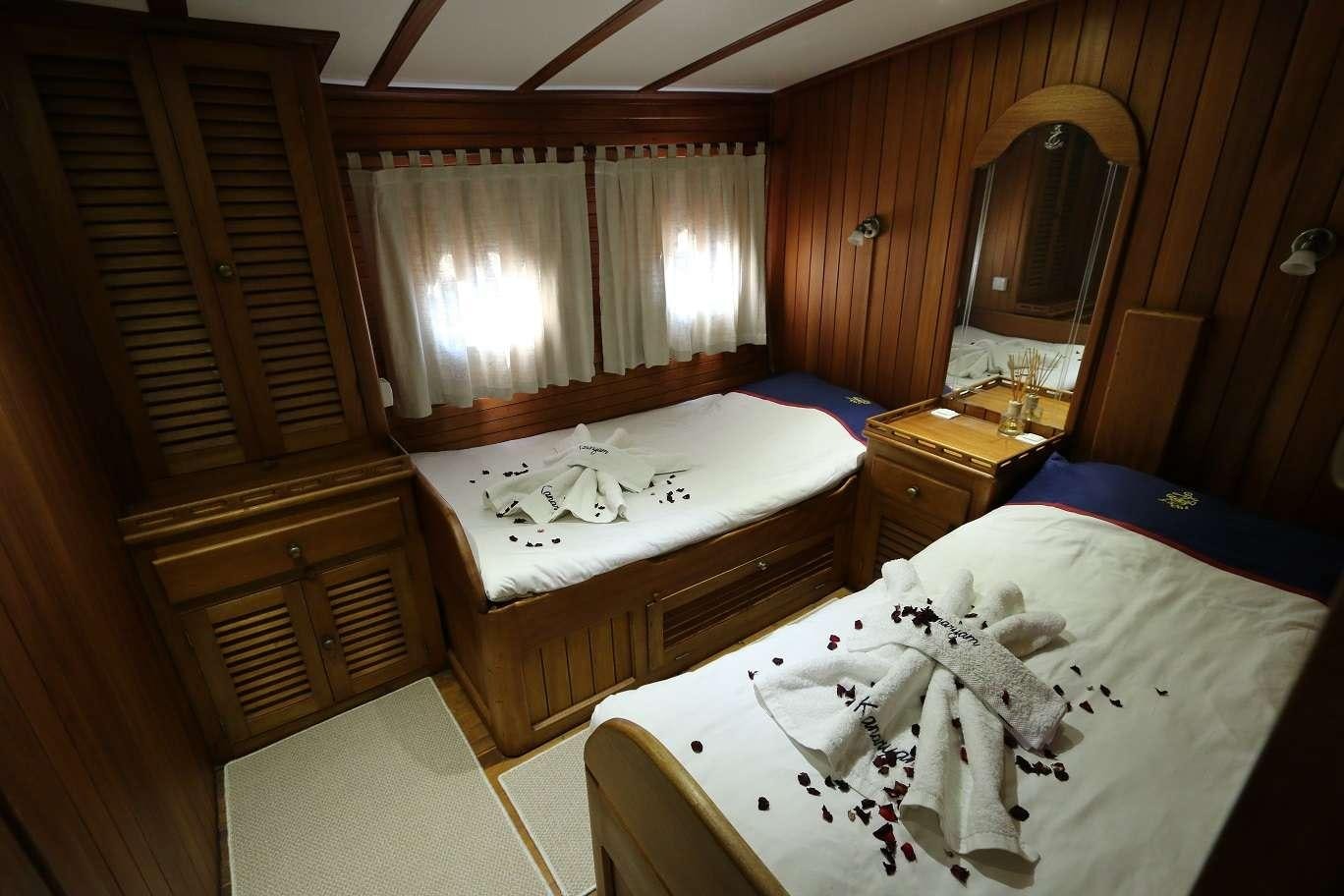 a couple of beds in a room aboard KANARYA Yacht for Charter