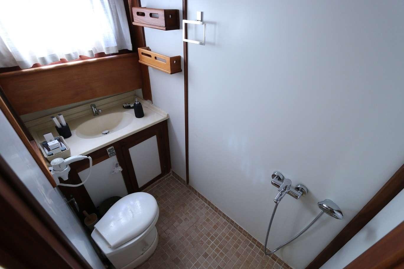 a bathroom with a sink and toilet aboard KANARYA Yacht for Charter
