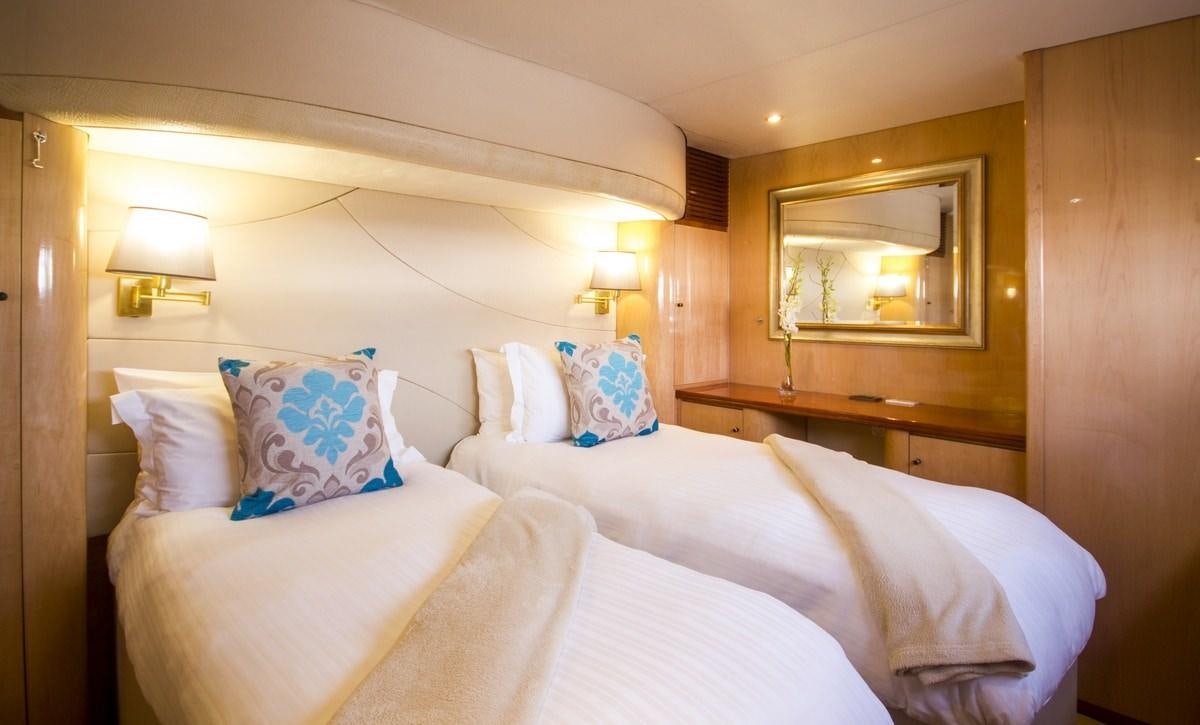 a couple of beds in a hotel room aboard KINGS RANSOM Yacht for Charter