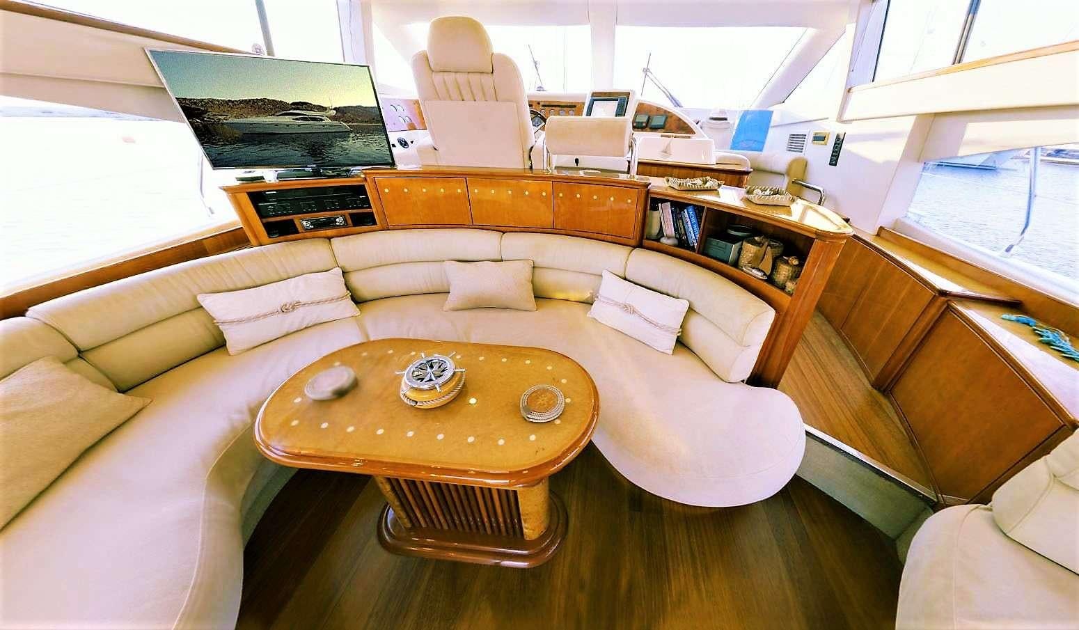 a living room with a couch and a coffee table aboard AVENTURA II Yacht for Charter