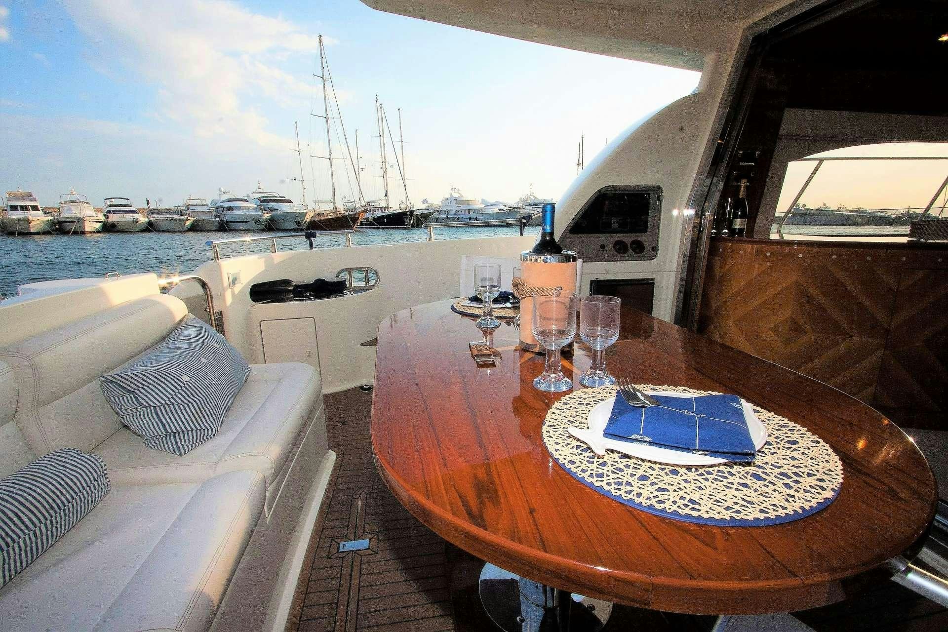a table with a plate on it aboard AVENTURA II Yacht for Charter