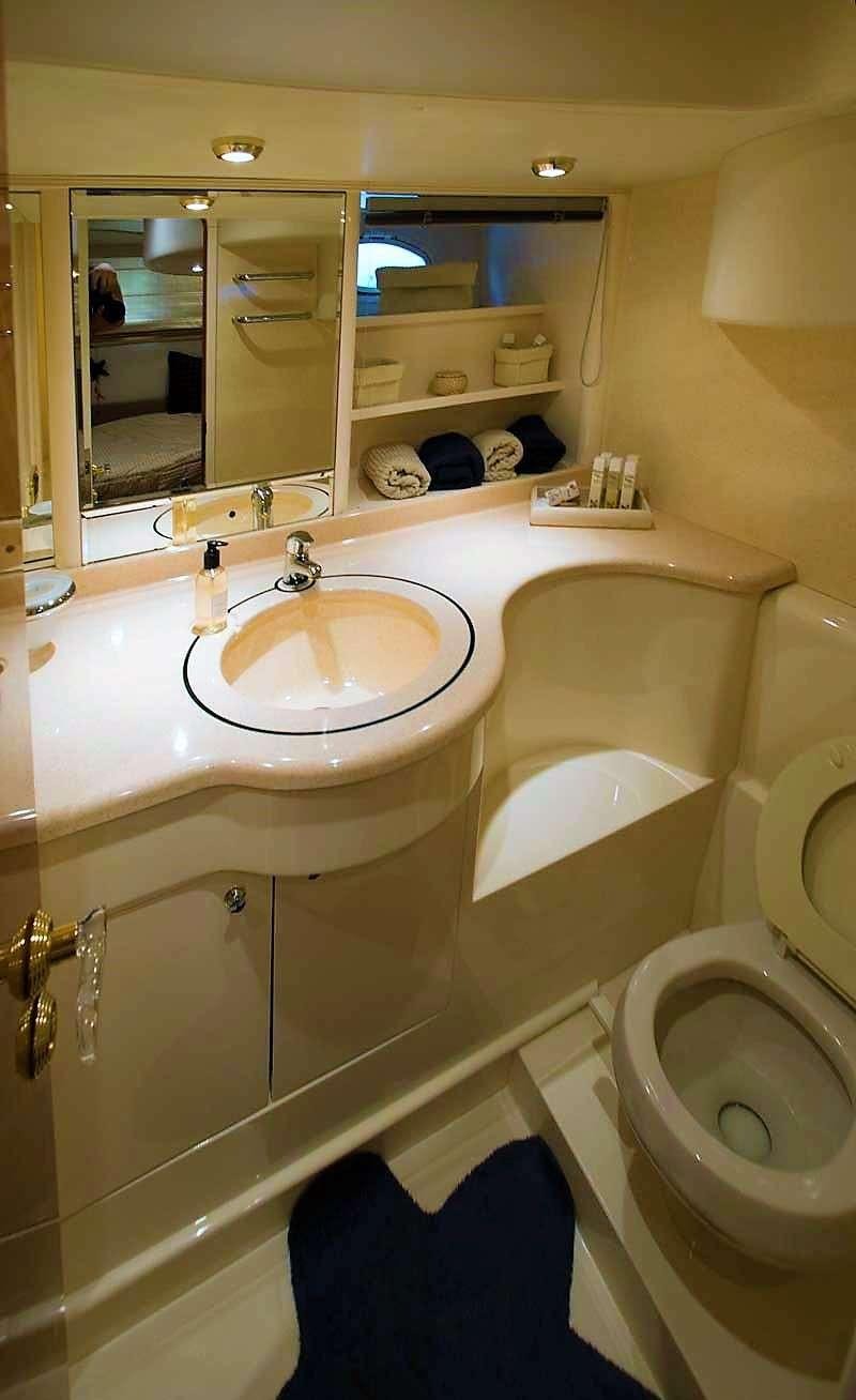 a bathroom with a sink and a toilet aboard AVENTURA II Yacht for Charter