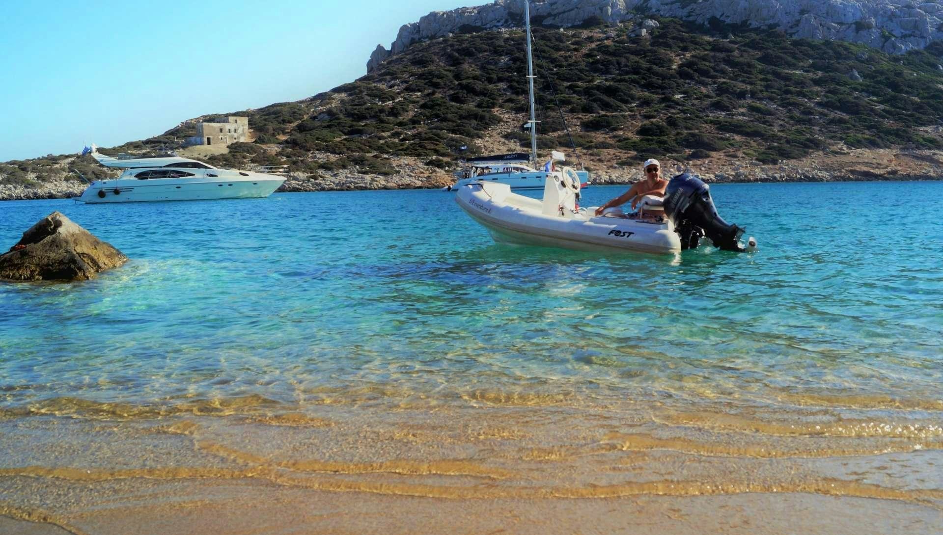 a man and a woman in a boat in the water aboard AVENTURA II Yacht for Charter