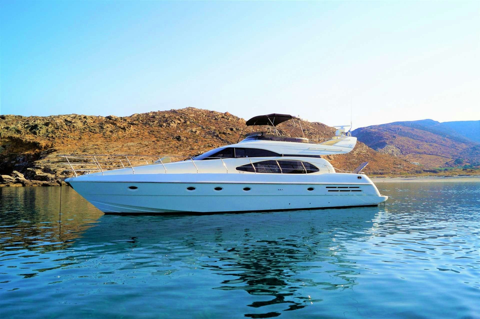 a white boat in the water aboard AVENTURA II Yacht for Charter