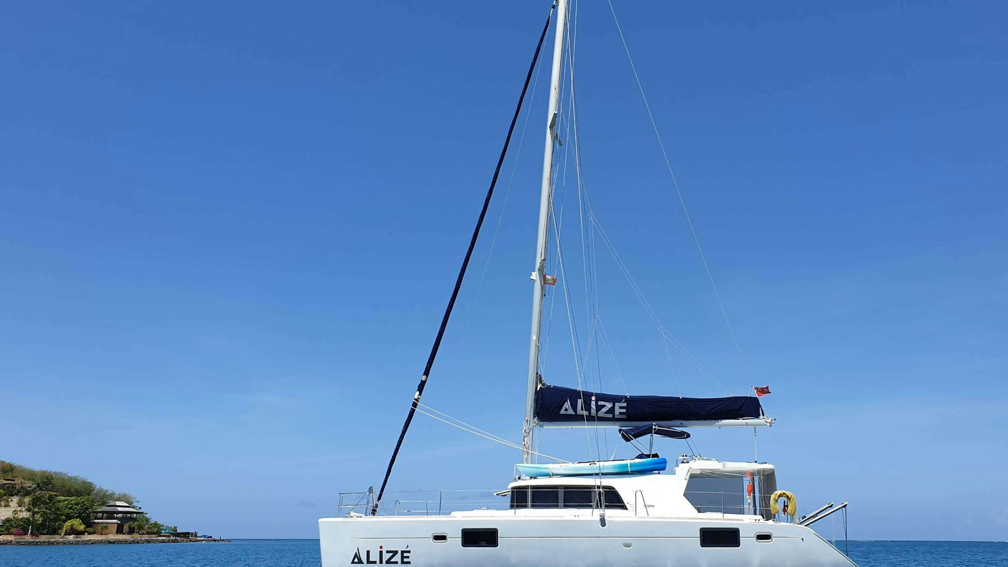 a white boat in the water aboard ALIZ&Eacute; Yacht for Charter