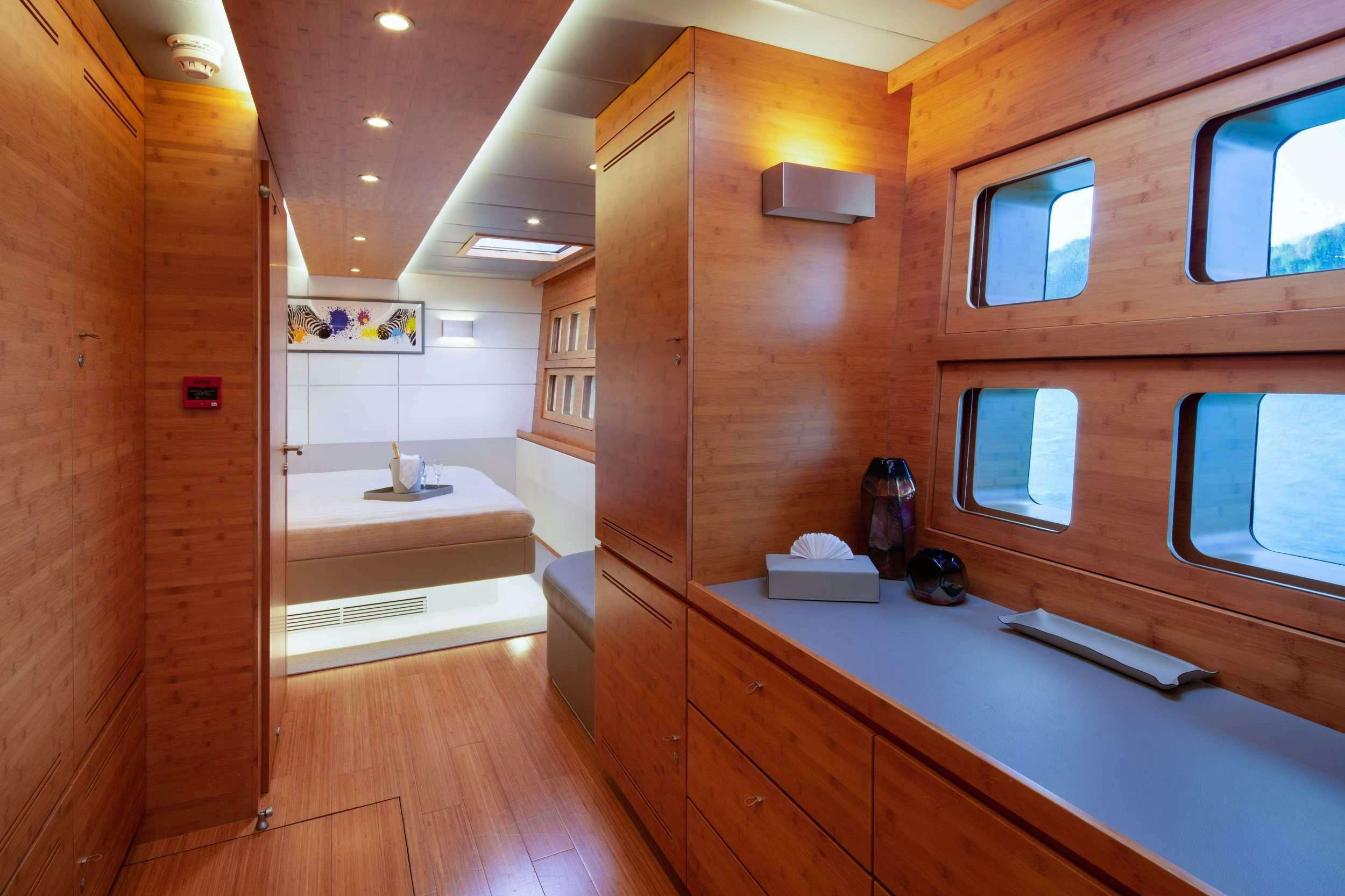 a bathroom with wooden cabinets aboard CHE Yacht for Charter