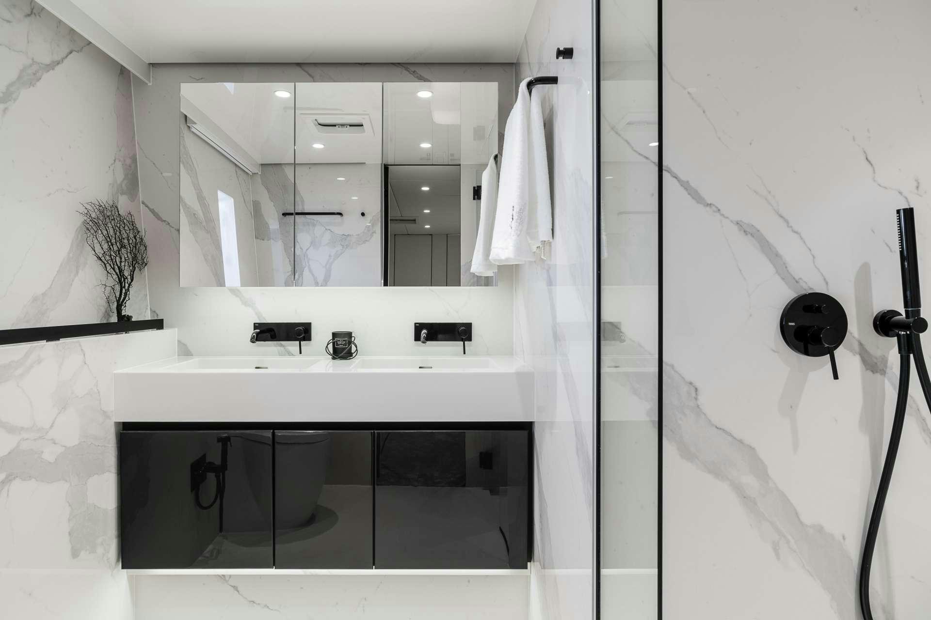 a bathroom with a sink and a mirror aboard ABOVE AND BEYOND Yacht for Charter