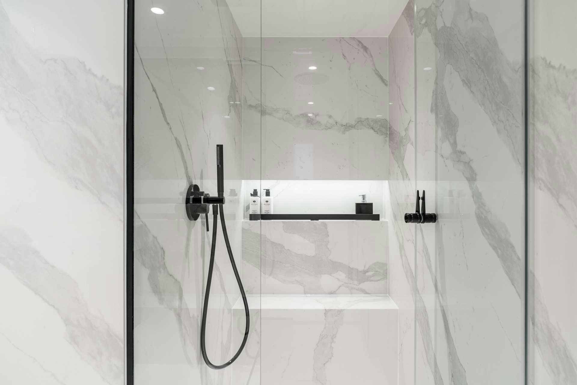 a shower with a glass door aboard ABOVE AND BEYOND Yacht for Charter