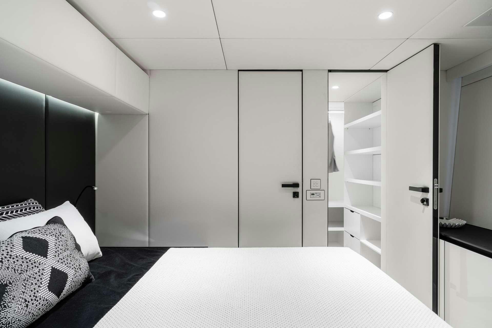 a room with a white table and shelves aboard ABOVE AND BEYOND Yacht for Charter