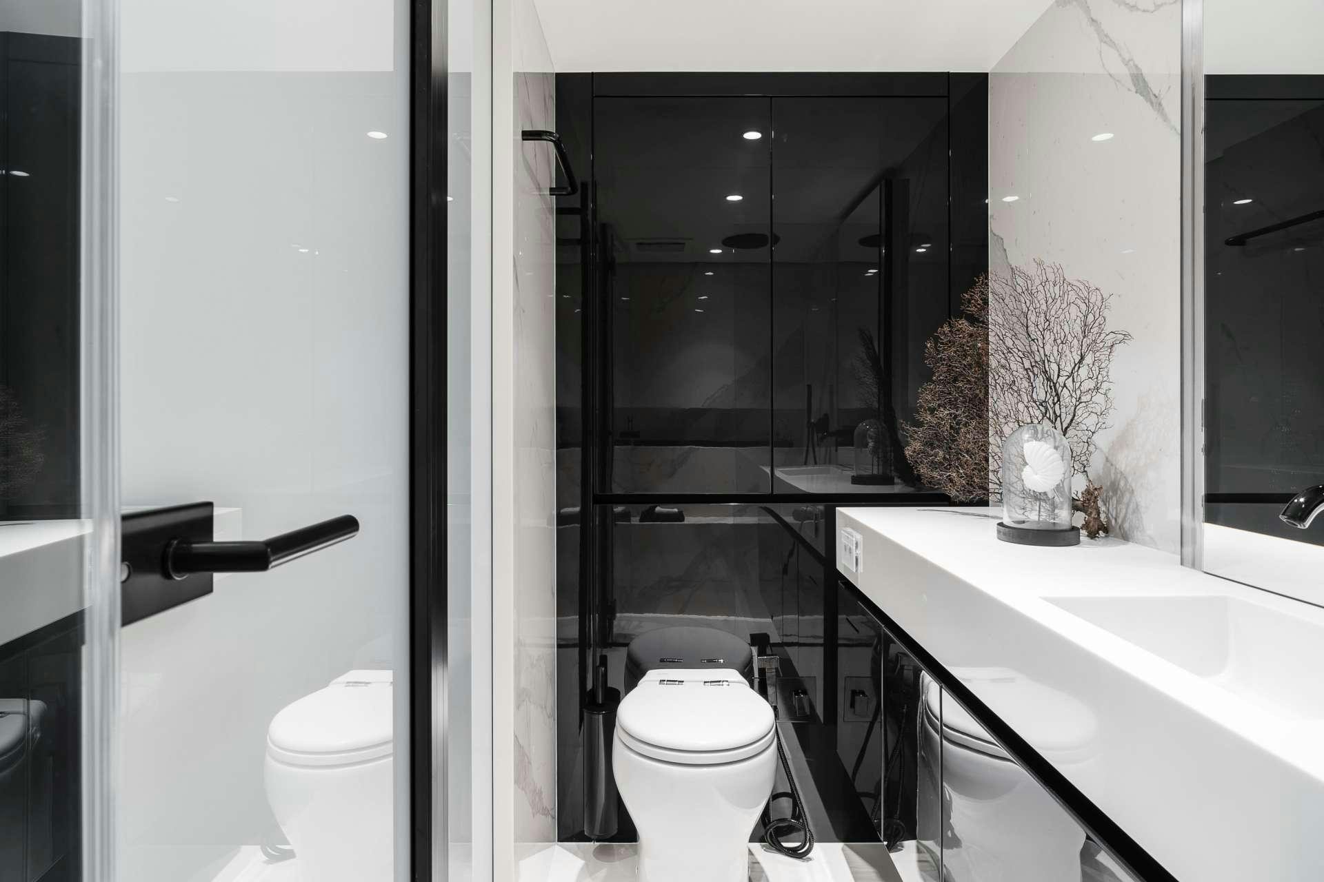 a bathroom with a sink toilet and bathtub aboard ABOVE AND BEYOND Yacht for Charter