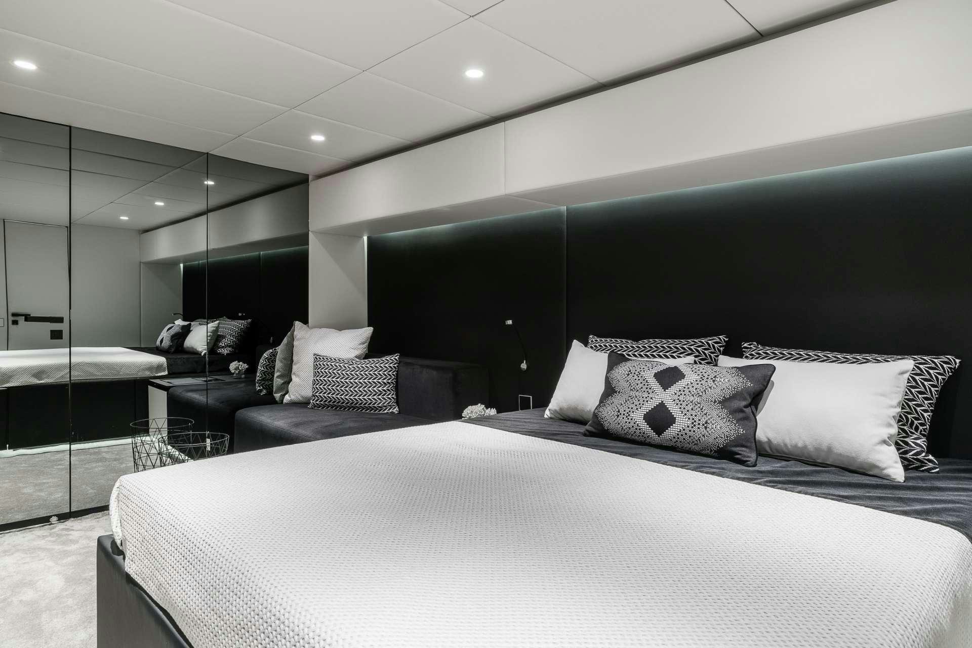 a large bed in a room aboard ABOVE AND BEYOND Yacht for Charter