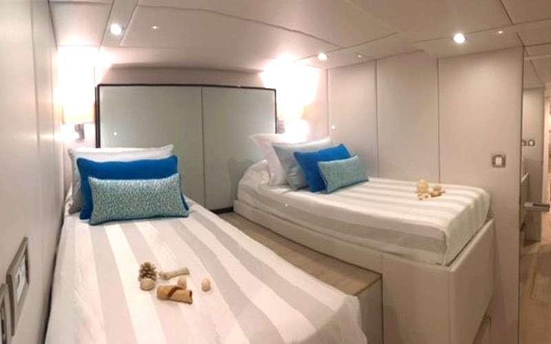 a room with a bed and a couple of stuffed animals aboard MAYRILOU Yacht for Charter