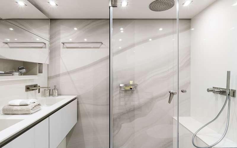 a bathroom with a shower unit aboard MAYRILOU Yacht for Charter