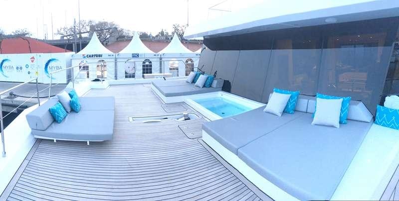 a room with a pool and a bed aboard MAYRILOU Yacht for Charter