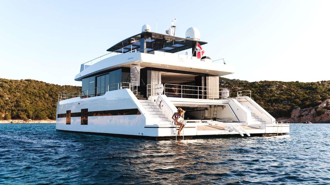a person standing on a boat aboard MAYRILOU Yacht for Charter