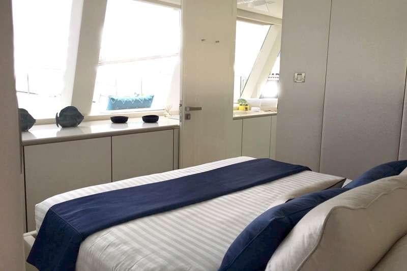 a bed in a room aboard MAYRILOU Yacht for Charter