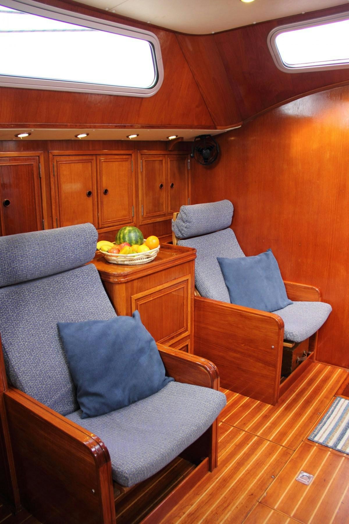 a living room with a couch and a table aboard EMILY MORGAN Yacht for Charter