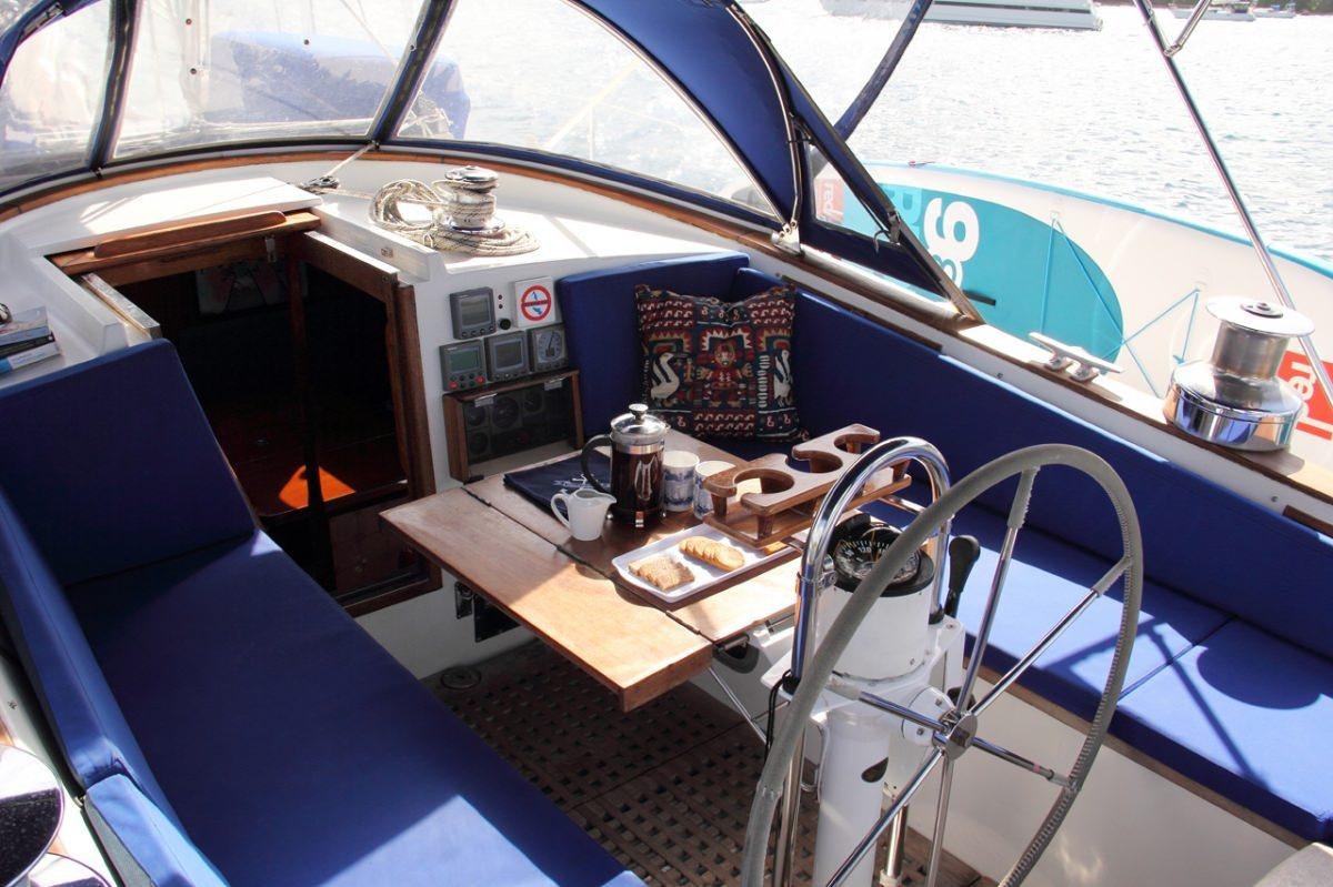 a boat with a table and chairs aboard EMILY MORGAN Yacht for Charter