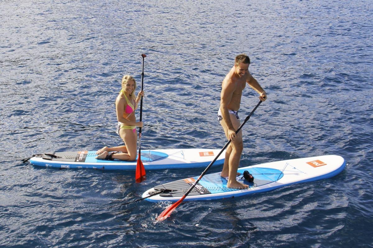 a man and woman on surfboards aboard EMILY MORGAN Yacht for Charter