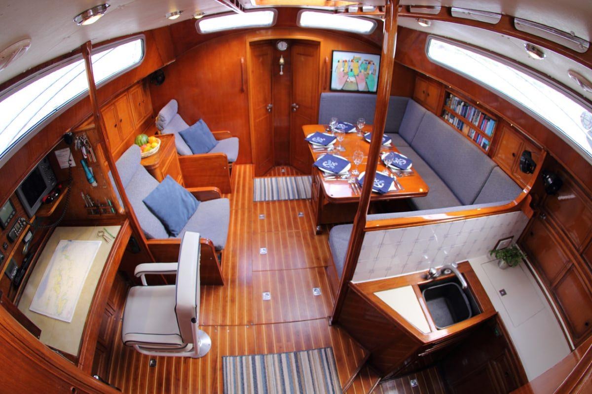 a room with a table and chairs aboard EMILY MORGAN Yacht for Charter