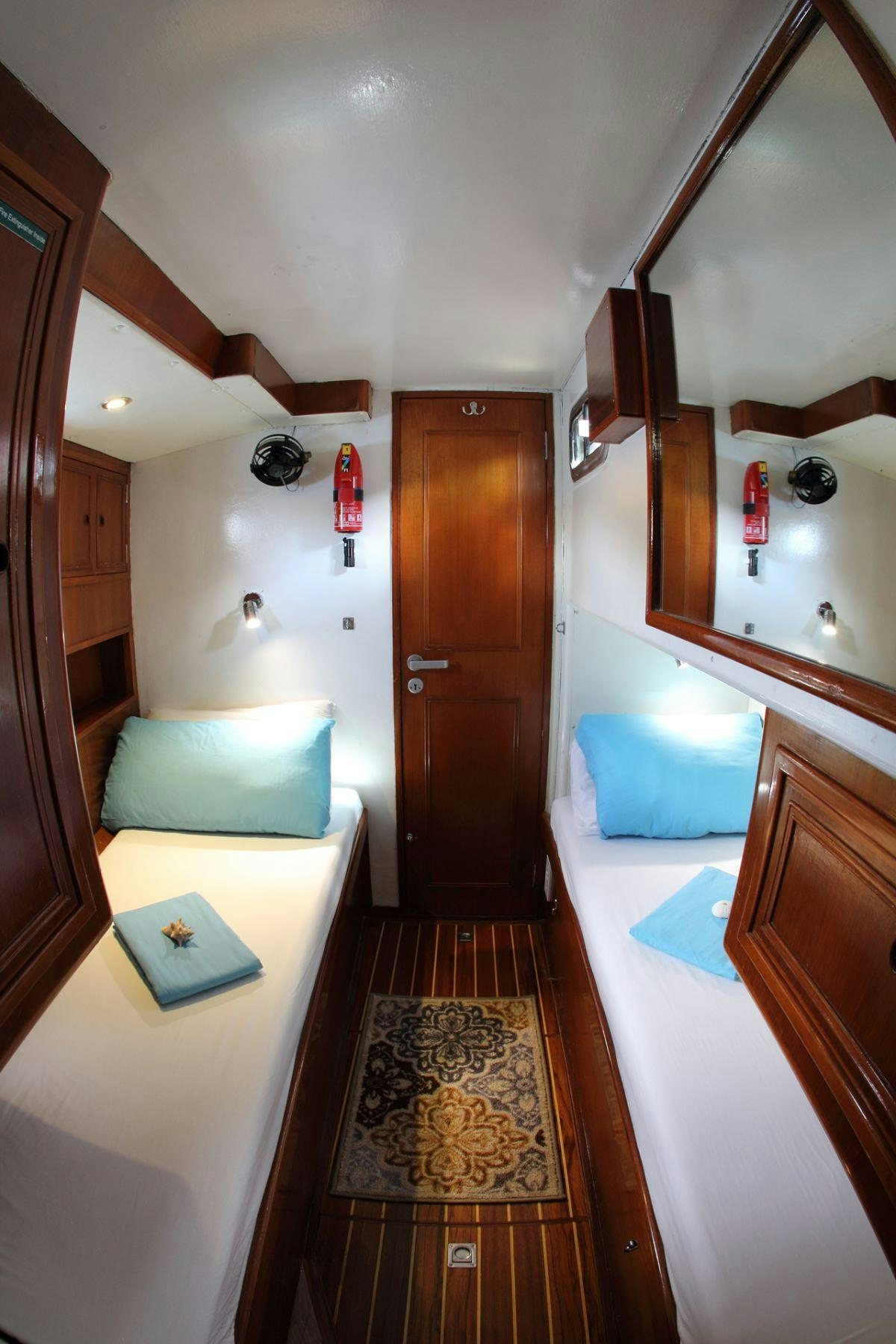 a room with a bed and a desk aboard EMILY MORGAN Yacht for Charter