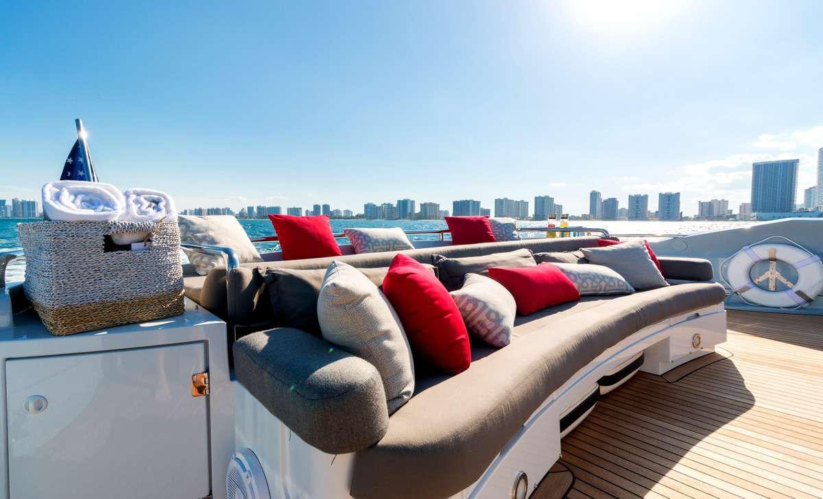 a bed with pillows and pillows aboard PRIVEE Yacht for Charter