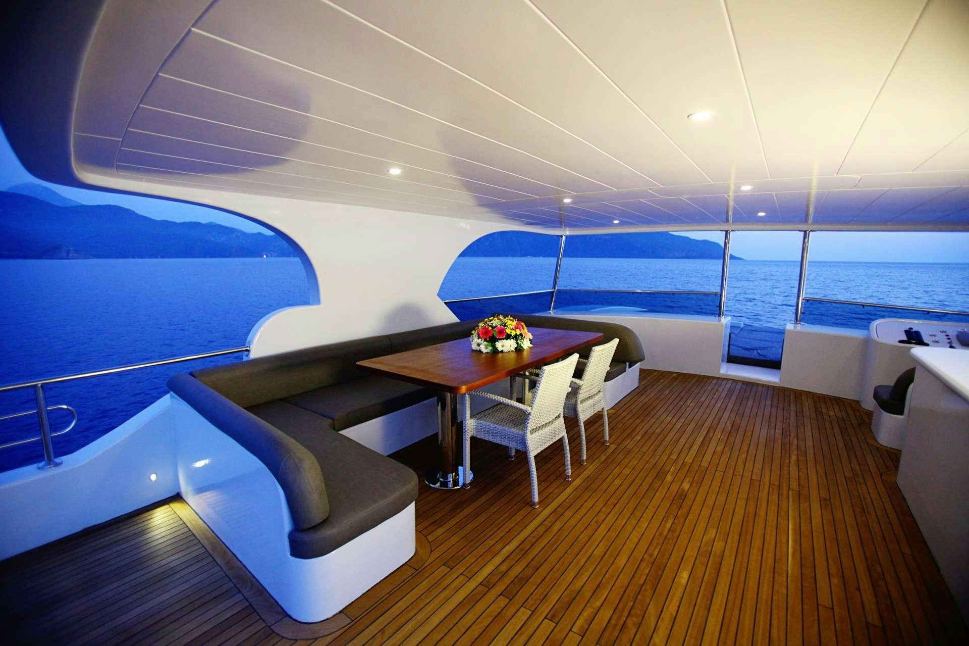 a room with a table and chairs aboard CROCUS Yacht for Charter