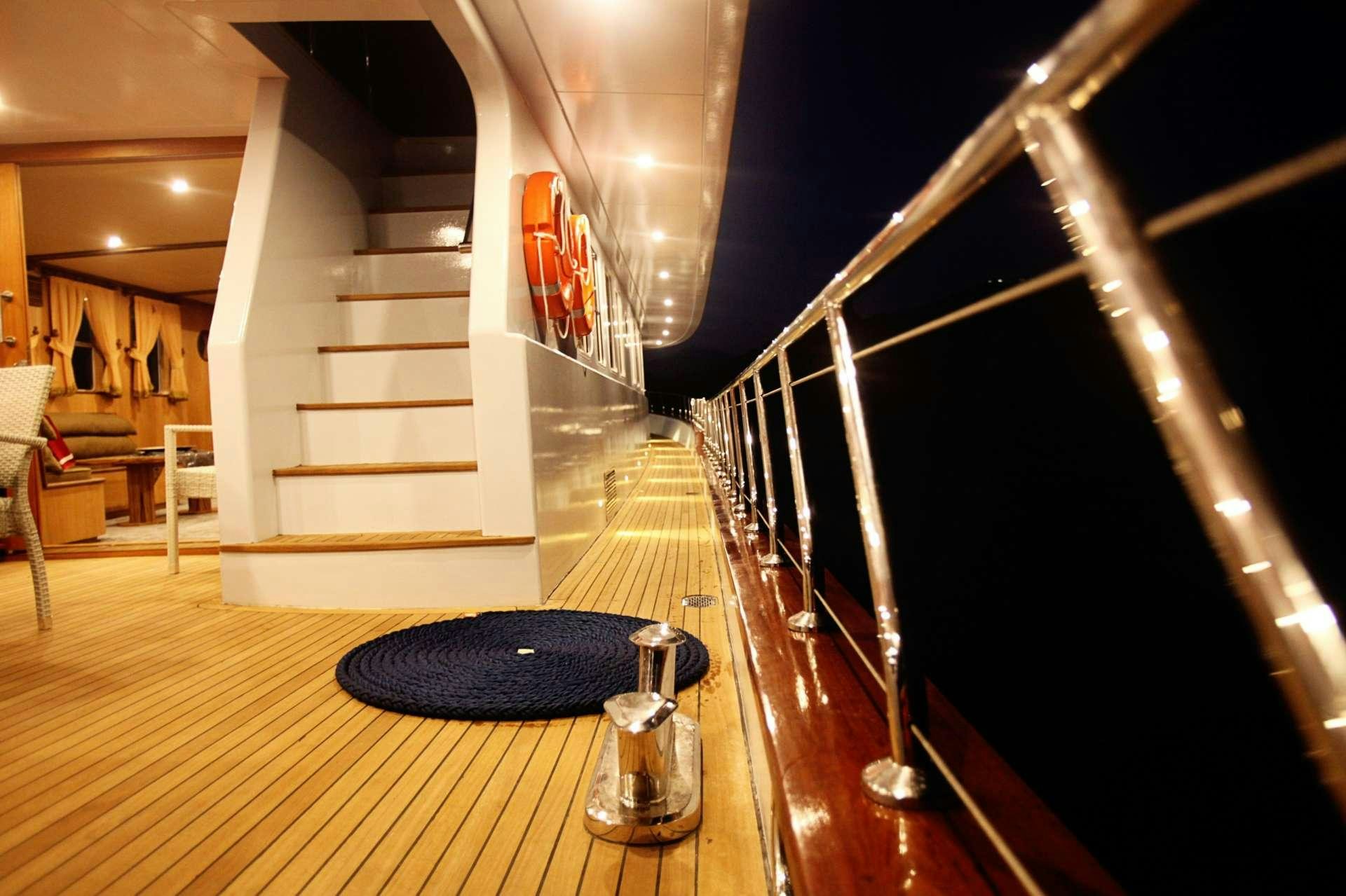 a staircase with a black railing aboard CROCUS Yacht for Charter
