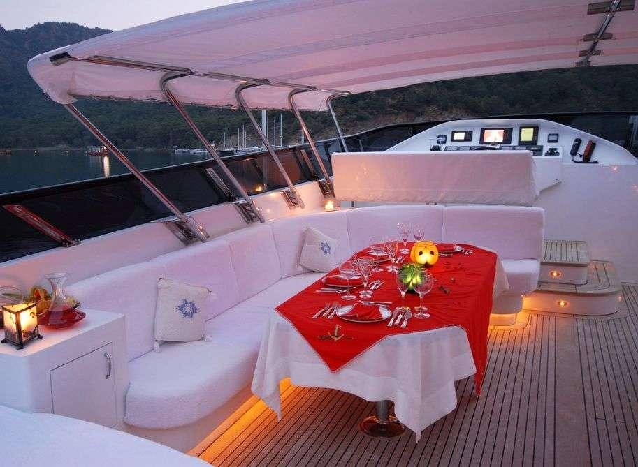 a table set up on a boat aboard CROCUS Yacht for Charter