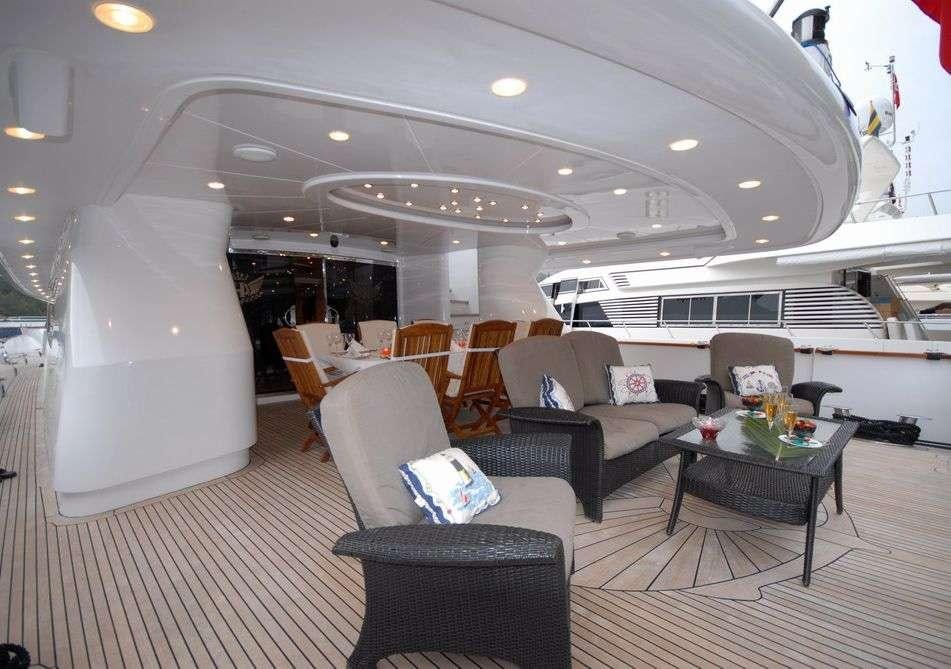 a room with a couch and a table and chairs aboard CROCUS Yacht for Charter