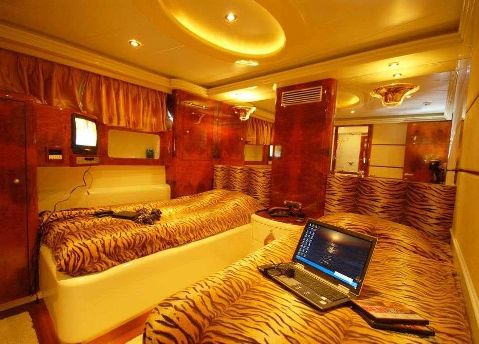 a laptop on a bed aboard CROCUS Yacht for Charter