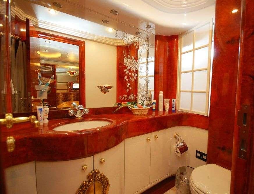 a bathroom with red walls aboard CROCUS Yacht for Charter