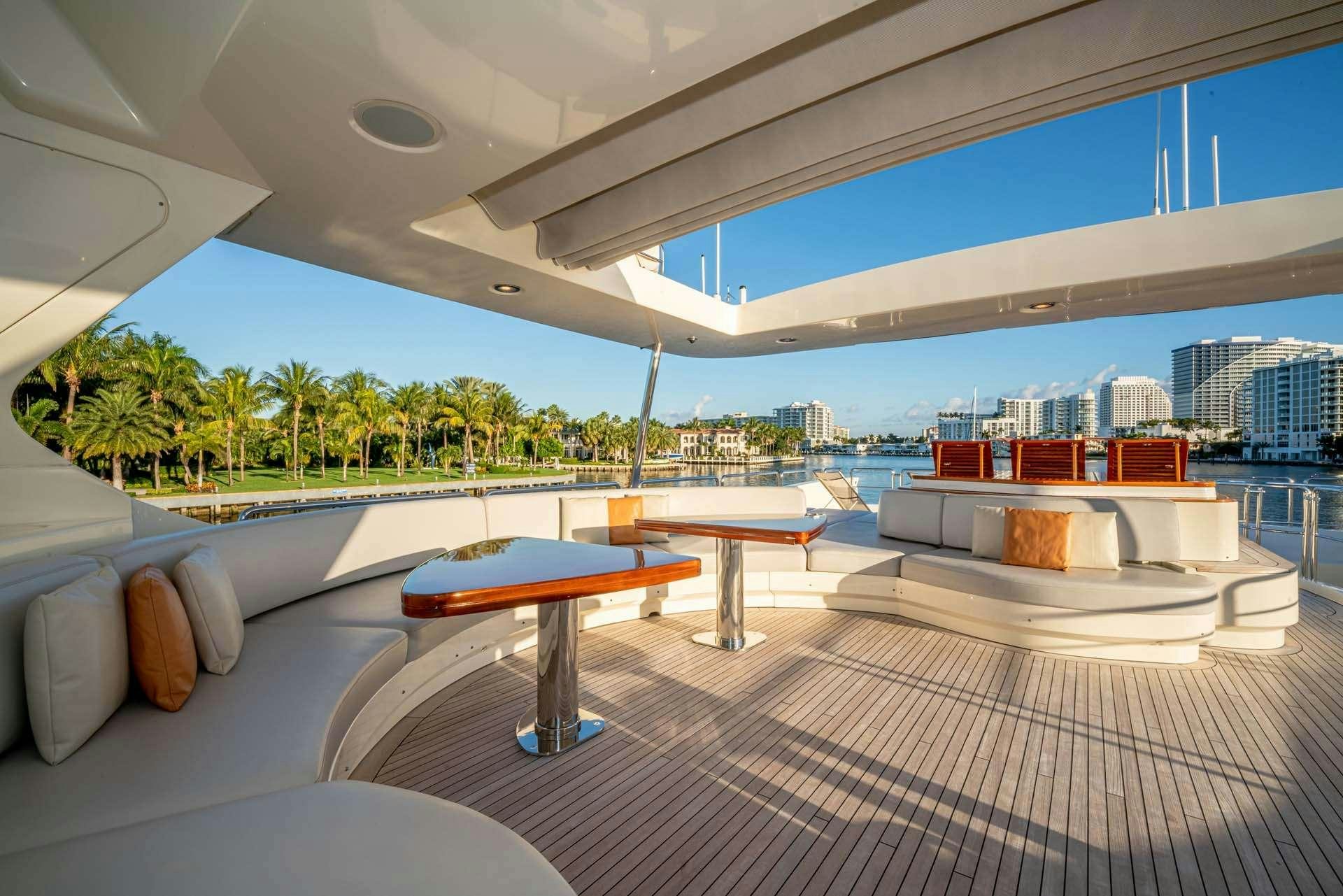 a room with a pool and a city in the background aboard VIVERE Yacht for Charter