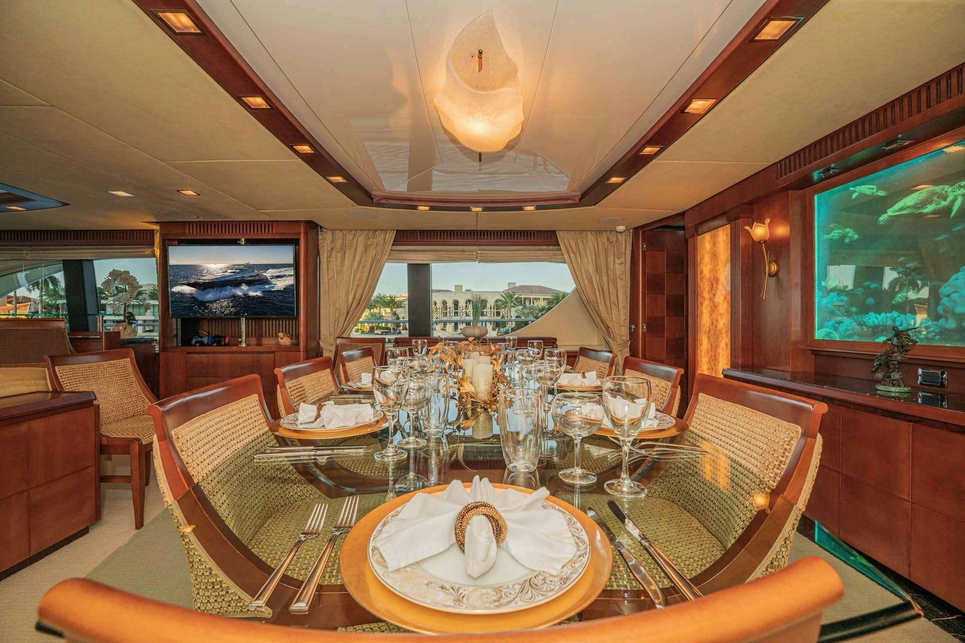 a dining room with a table set aboard VIVERE Yacht for Charter