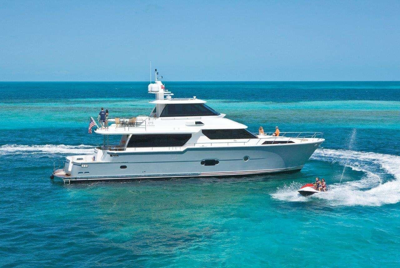 a large white yacht with people on it aboard SILVER LINING Yacht for Charter
