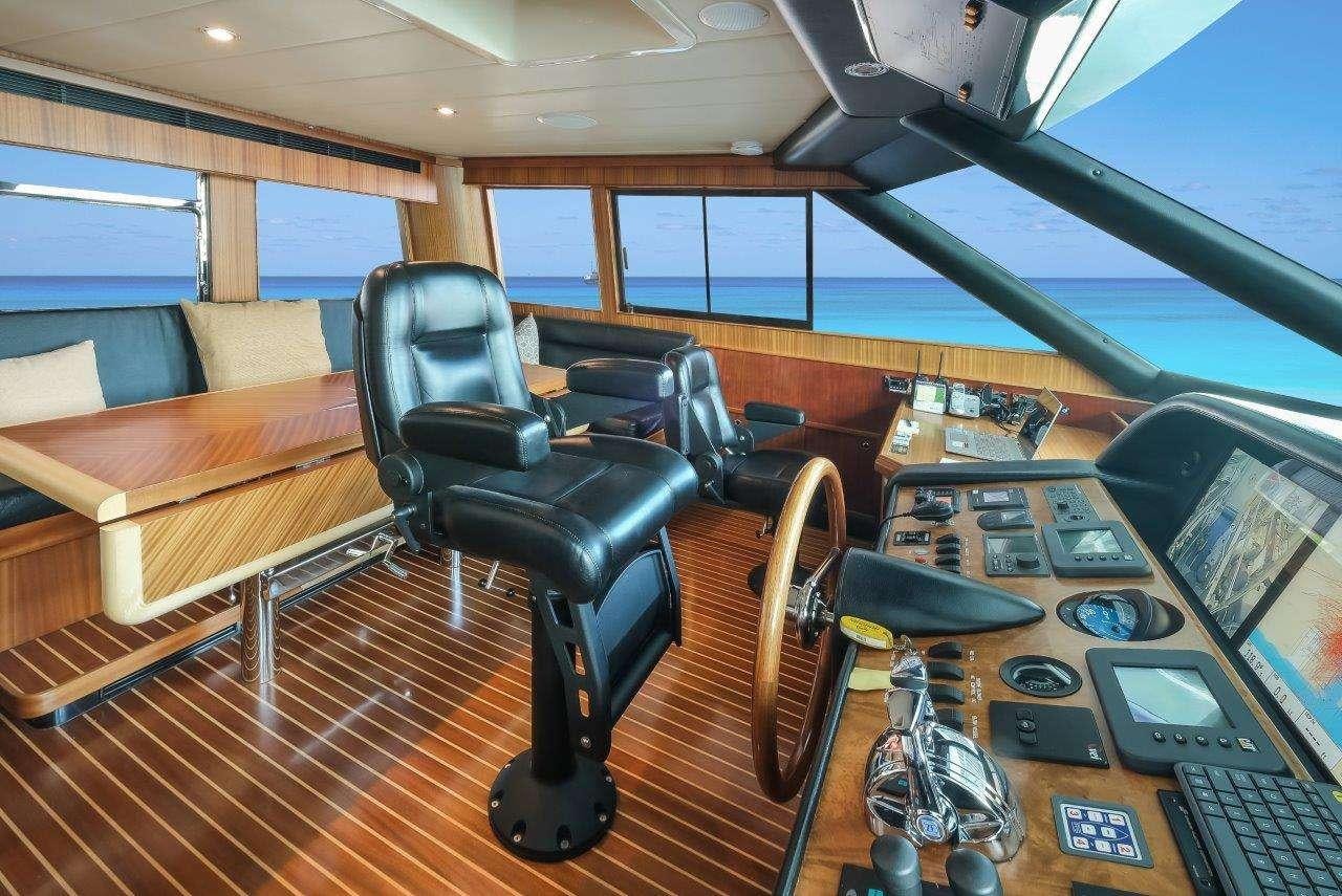 a room with a table and chairs aboard SILVER LINING Yacht for Charter