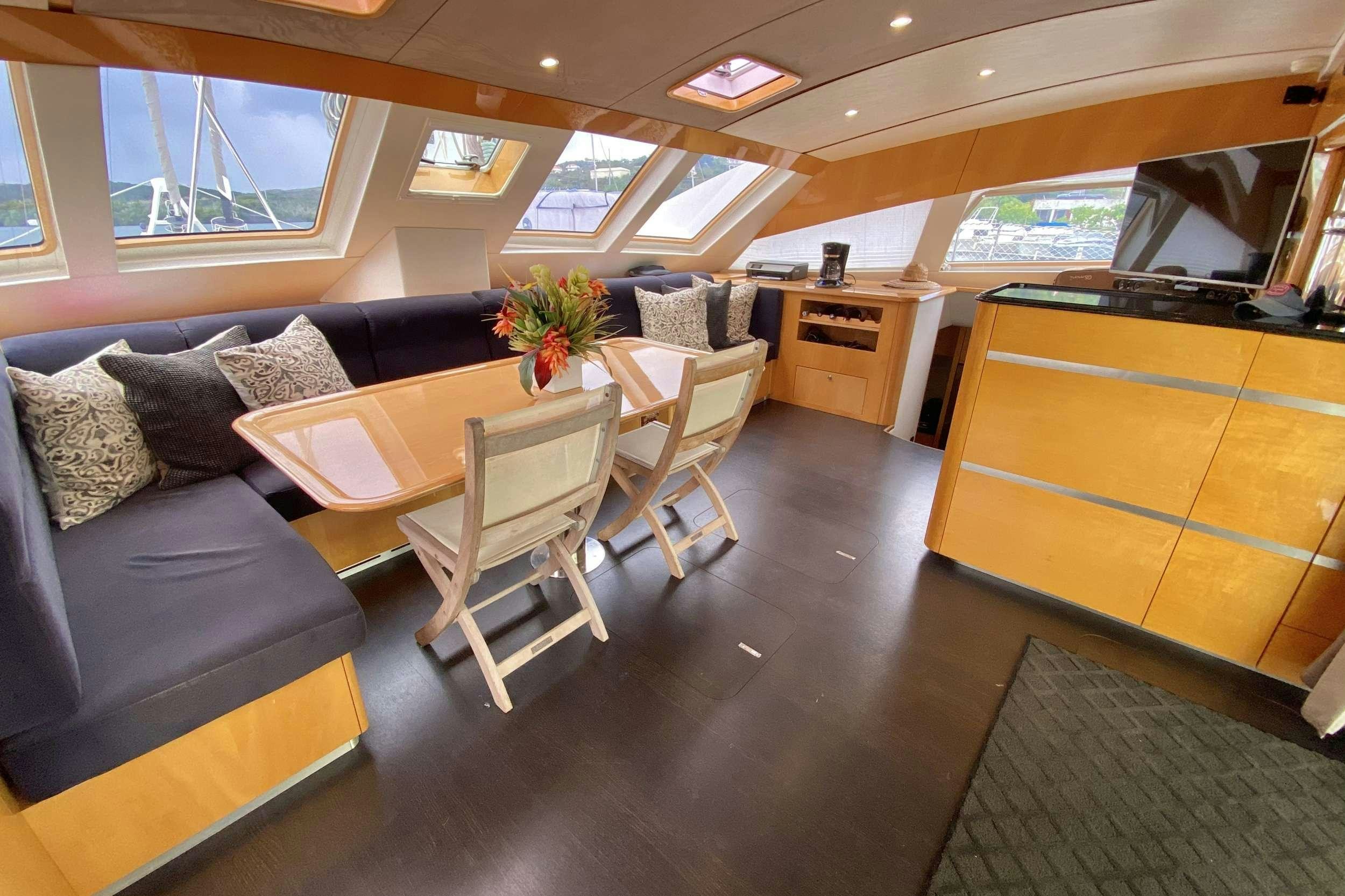 a living room with a couch and a table aboard TRES SUENOS Yacht for Charter