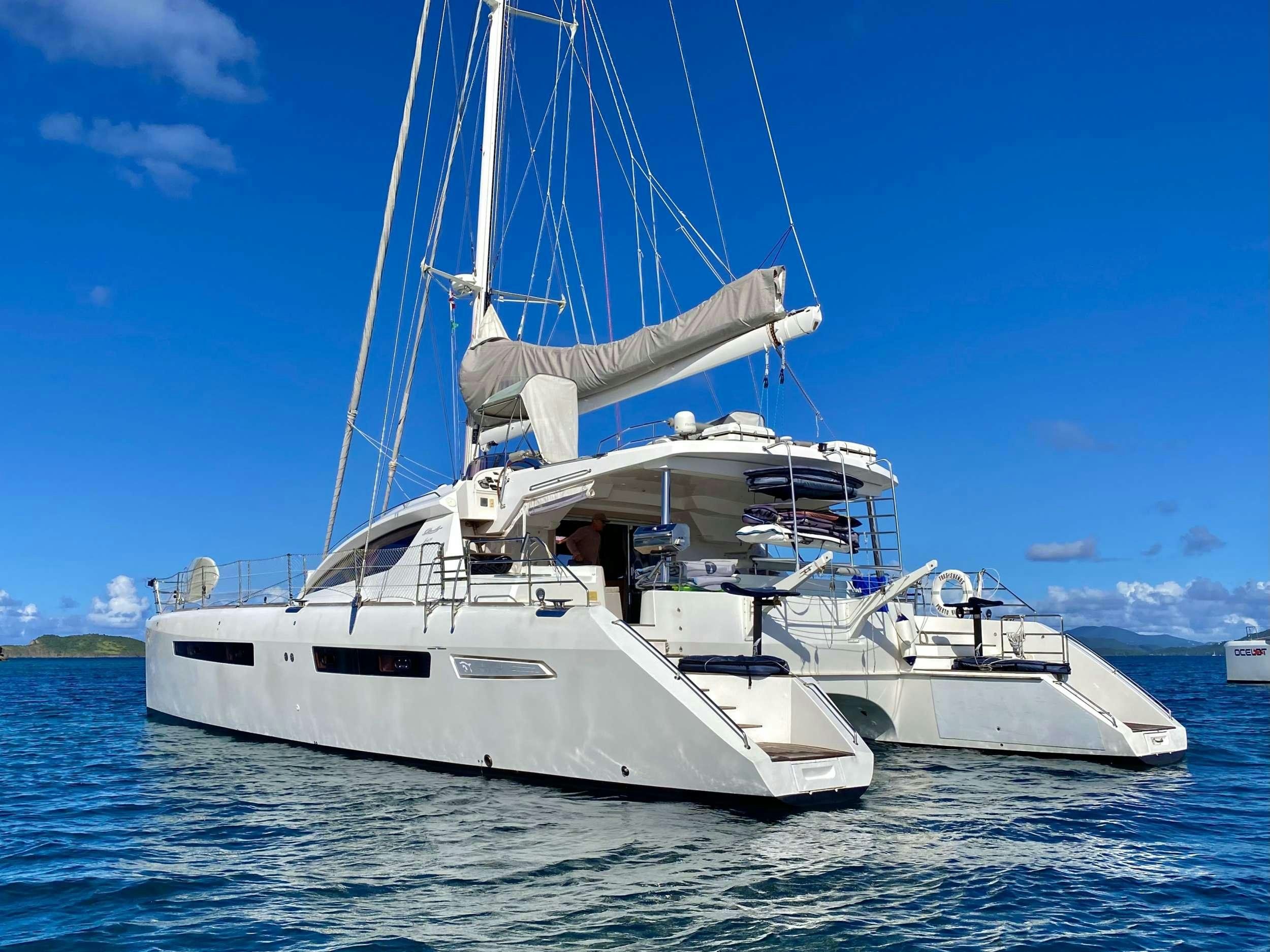 a white boat in the water aboard TRES SUENOS Yacht for Charter