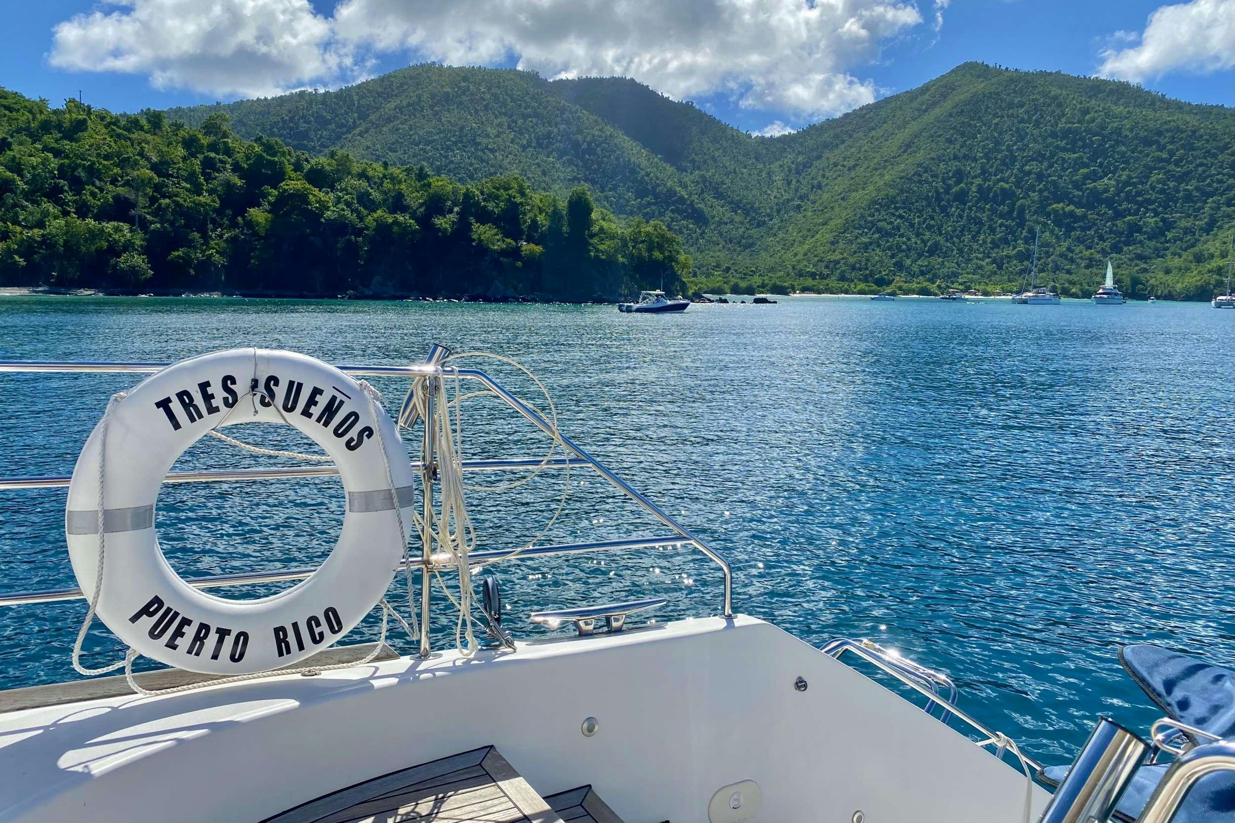 a boat on the water aboard TRES SUENOS Yacht for Charter