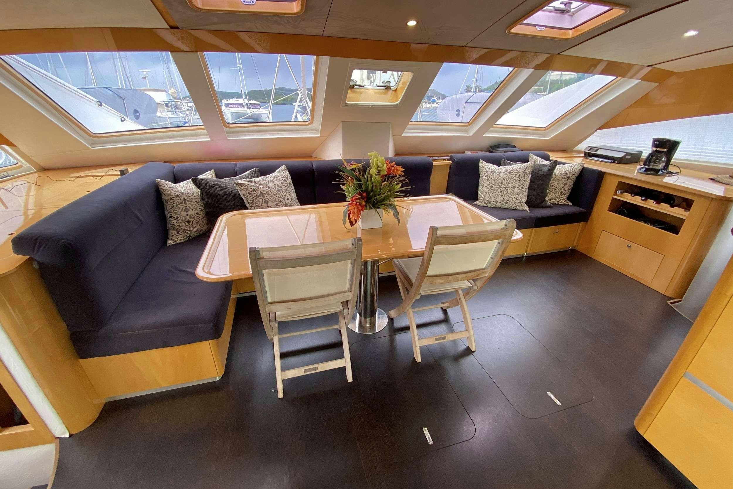 a room with a couch and a table aboard TRES SUENOS Yacht for Charter
