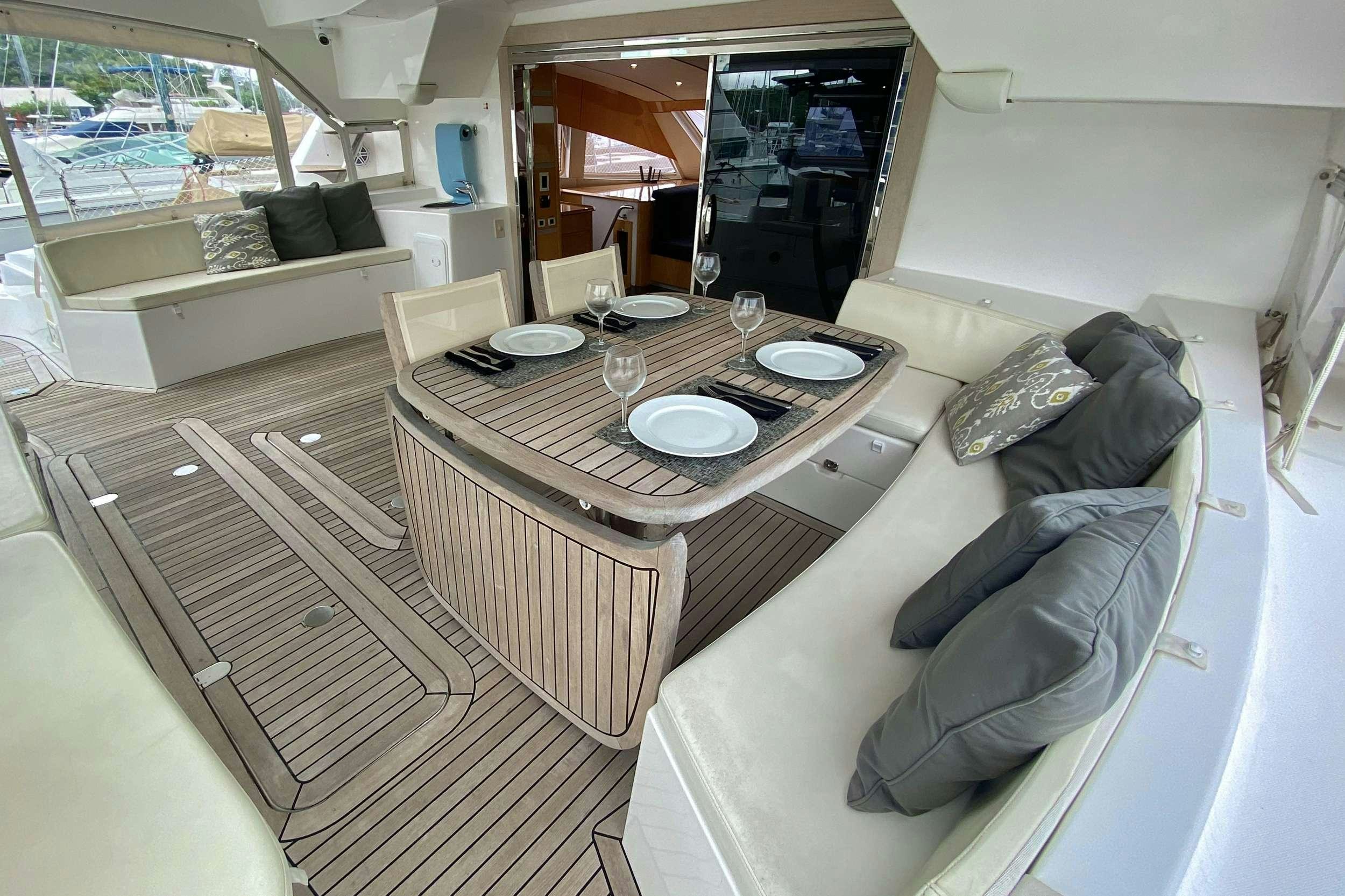 a living room with a couch and a table aboard TRES SUENOS Yacht for Charter