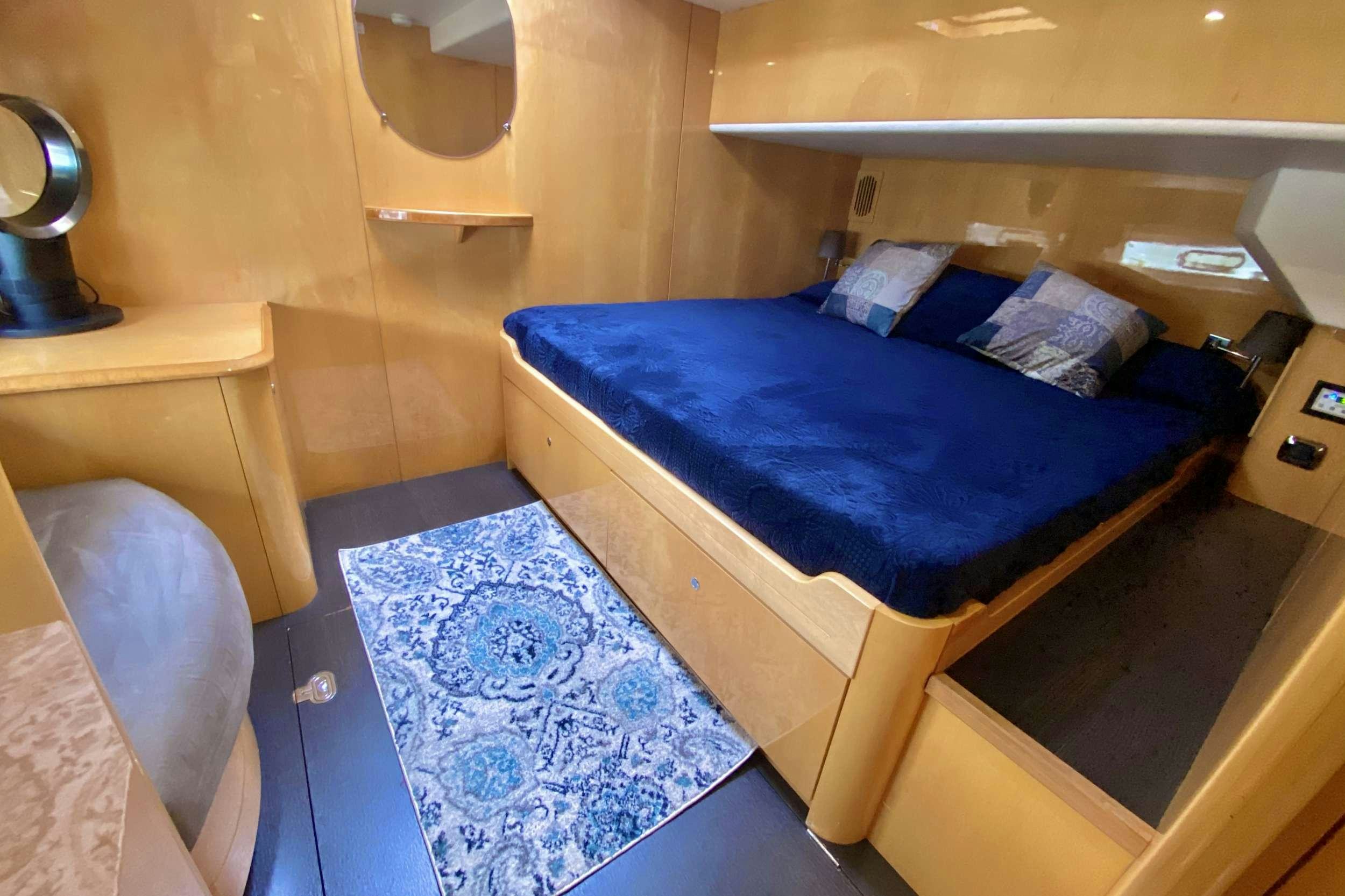 a bed in a room aboard TRES SUENOS Yacht for Charter