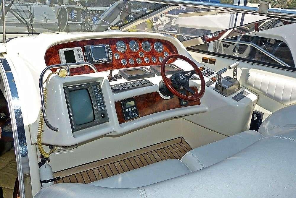 the inside of a car aboard OBSESSION Yacht for Charter