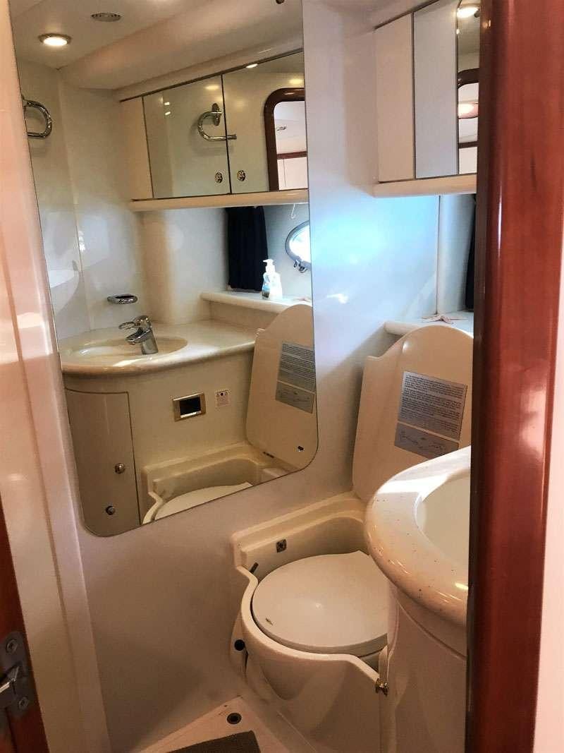 a bathroom with a sink and a toilet aboard OBSESSION Yacht for Charter