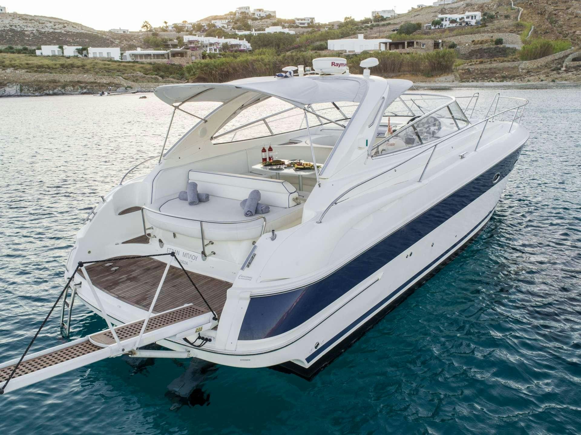 a white boat in the water aboard AEGEAN BLUE Yacht for Charter